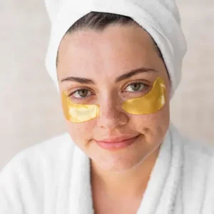 close-up-smiley-woman-with-eye-patches_23-2148709292