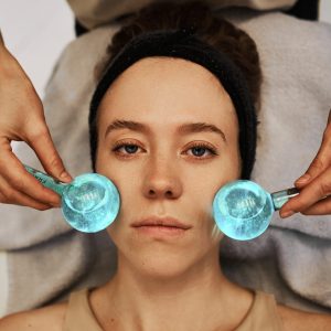 Facial massage with cold spheres. High quality photo